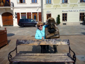 Bronze statue with tourist